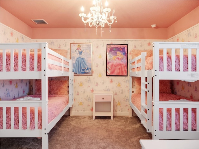 bedroom with carpet floors and a chandelier