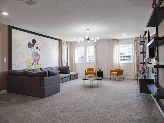 carpeted living room with an inviting chandelier and a textured ceiling