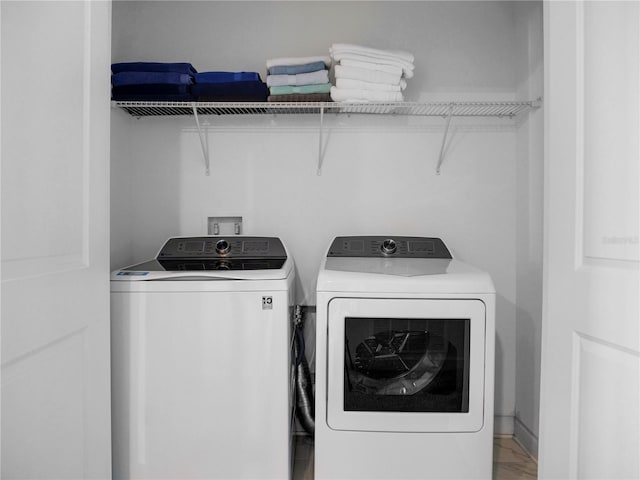 washroom with washing machine and dryer