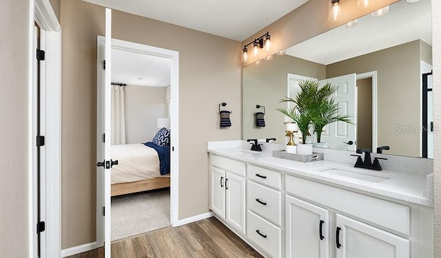 bathroom with hardwood / wood-style flooring and vanity