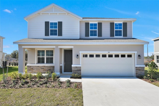 view of front facade featuring a garage, a porch, and a front yard