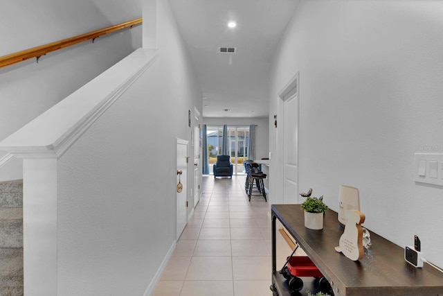 hallway featuring light tile patterned floors