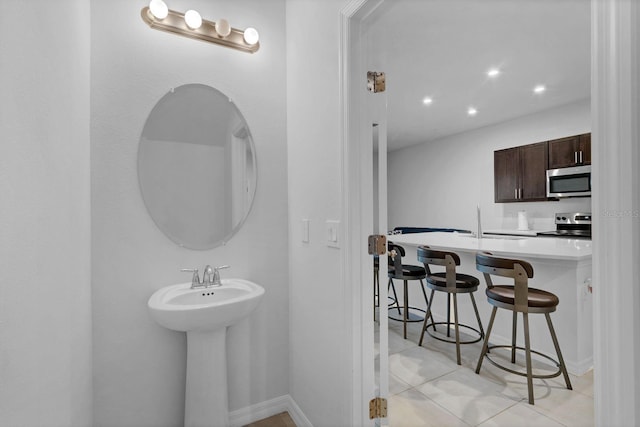 bathroom with sink and tile patterned floors