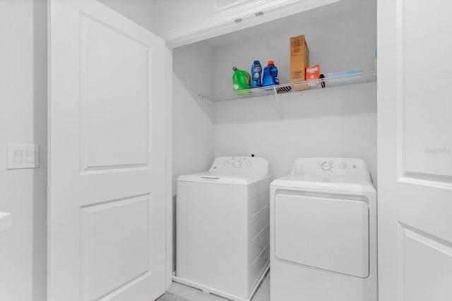 laundry area with washing machine and clothes dryer