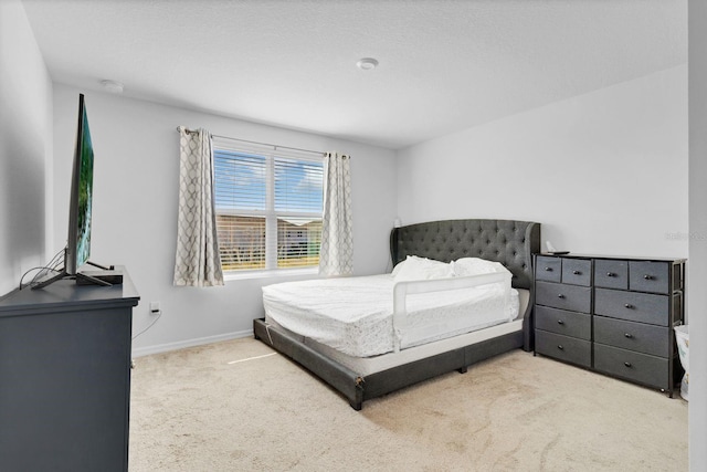 bedroom with light colored carpet