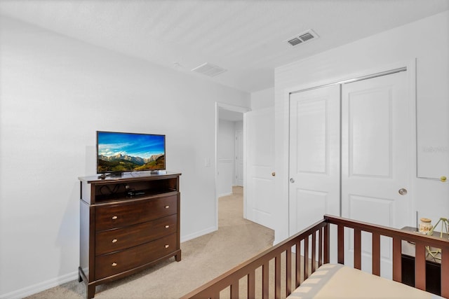 carpeted bedroom featuring a closet