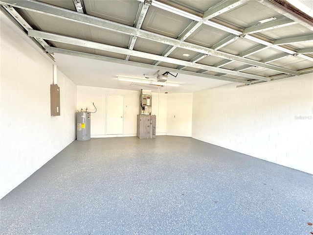 garage with a garage door opener, electric panel, and electric water heater