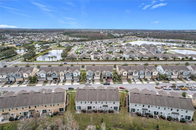 birds eye view of property with a water view and a residential view