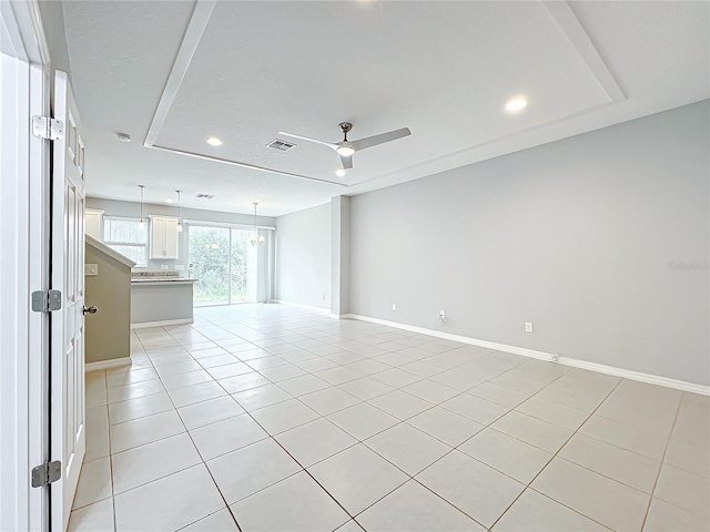 unfurnished room with light tile patterned floors, ceiling fan, recessed lighting, visible vents, and baseboards