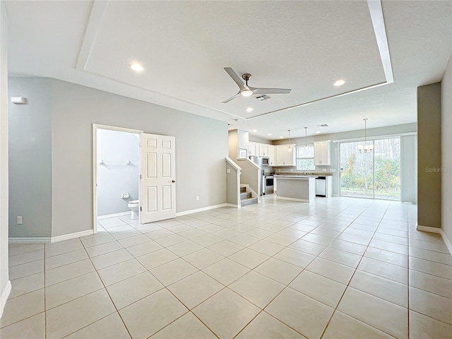 unfurnished living room featuring stairs, recessed lighting, ceiling fan, and light tile patterned floors