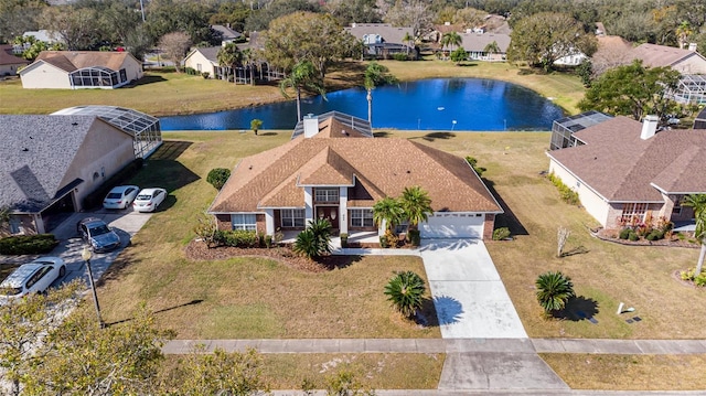 drone / aerial view with a water view