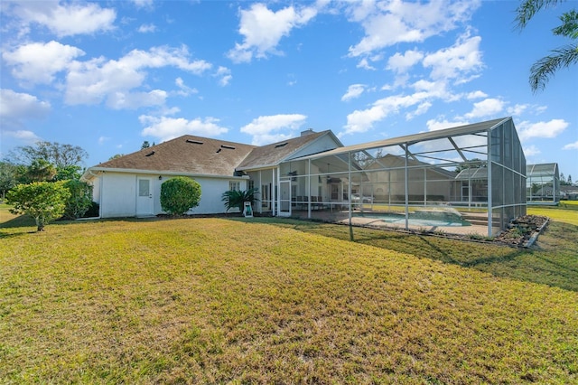 rear view of house with a yard