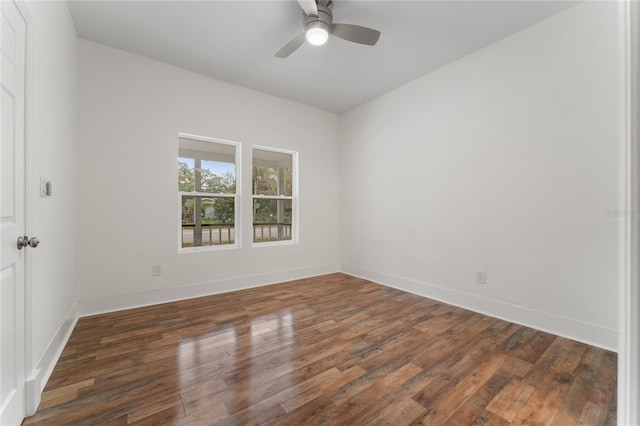 empty room featuring dark hardwood / wood-style floors and ceiling fan