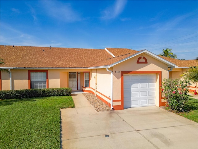 ranch-style home with a garage and a front yard