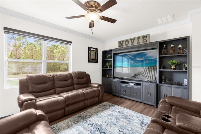 living room featuring ornamental molding, hardwood / wood-style floors, and ceiling fan