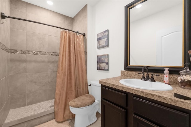 bathroom with walk in shower, vanity, and toilet