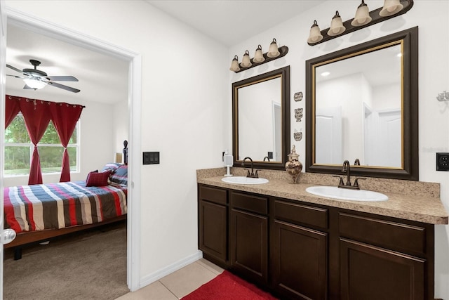 bathroom featuring tile patterned flooring, vanity, and ceiling fan