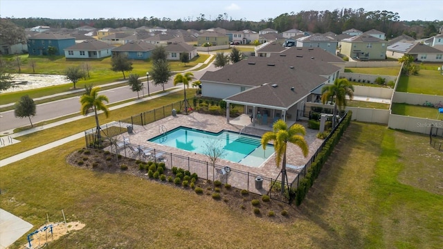 view of swimming pool featuring a patio and a lawn