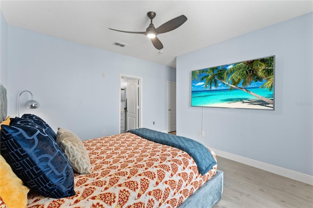 bedroom with ceiling fan and hardwood / wood-style floors