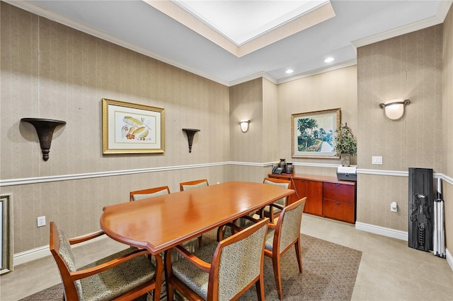 dining room featuring crown molding and light carpet