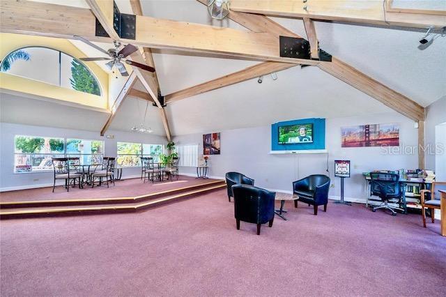 sitting room with ceiling fan, beam ceiling, high vaulted ceiling, and carpet