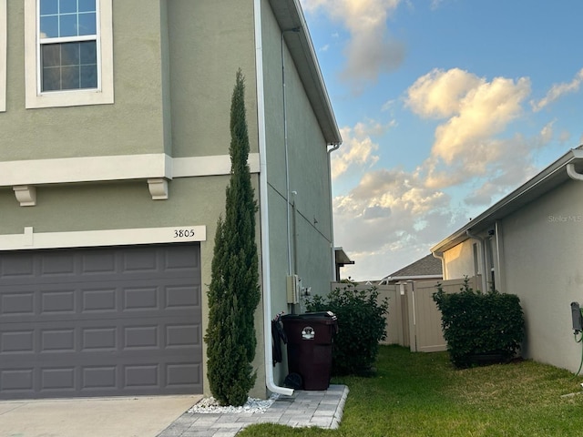 view of side of home with a garage