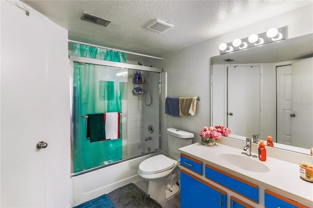 full bathroom featuring enclosed tub / shower combo, vanity, a textured ceiling, and toilet