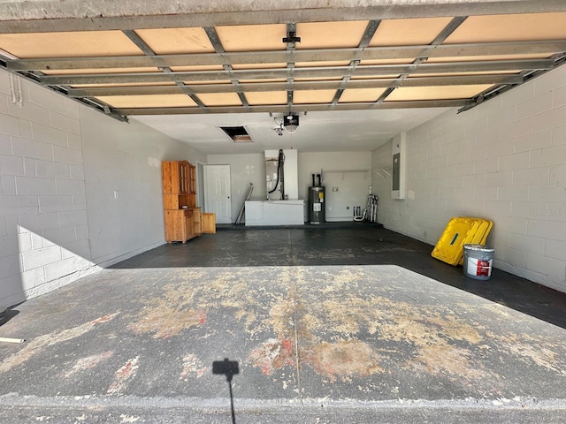 garage with a garage door opener, electric panel, and electric water heater