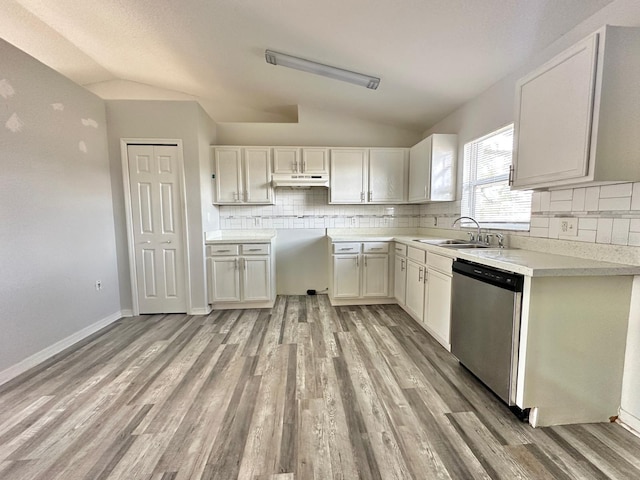 kitchen with lofted ceiling, sink, light wood-type flooring, dishwasher, and white cabinets