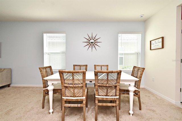 view of carpeted dining space