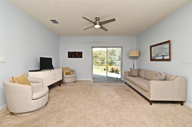 carpeted living room featuring ceiling fan