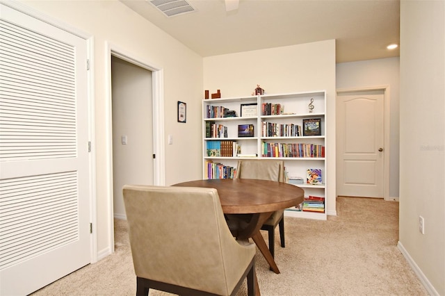 dining area with light colored carpet