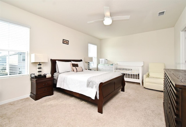 carpeted bedroom featuring ceiling fan