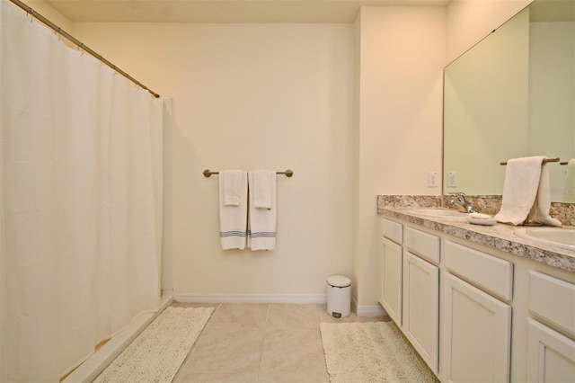 bathroom with tile patterned flooring and vanity