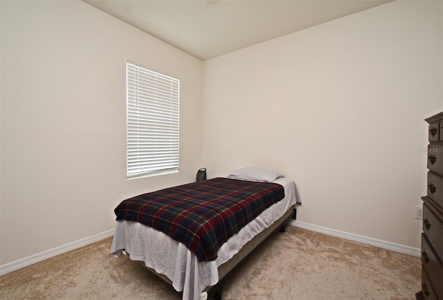 bedroom featuring light colored carpet