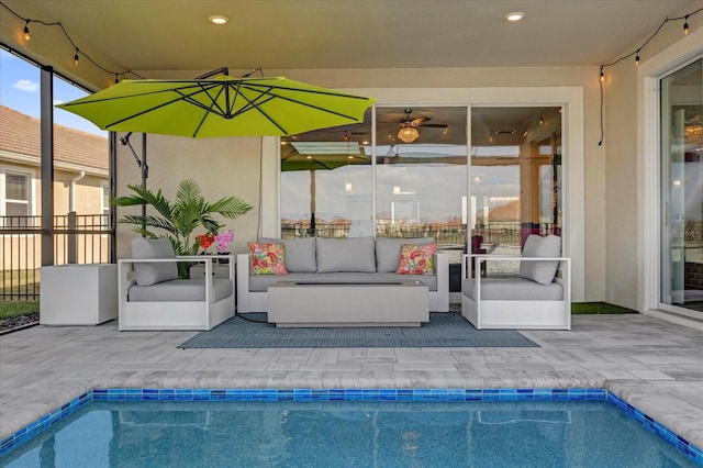 view of patio featuring a fenced in pool and an outdoor hangout area