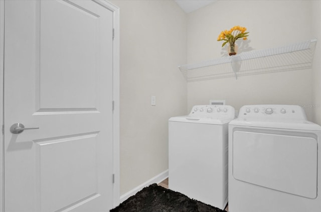 washroom with independent washer and dryer