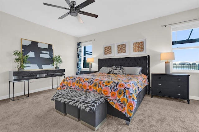 bedroom featuring a water view, ceiling fan, and carpet floors