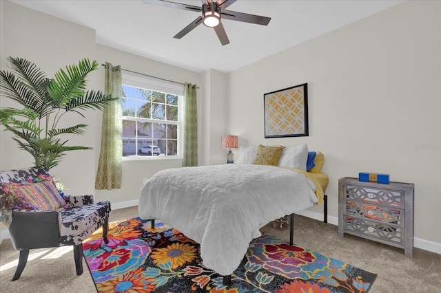 bedroom featuring light carpet and ceiling fan