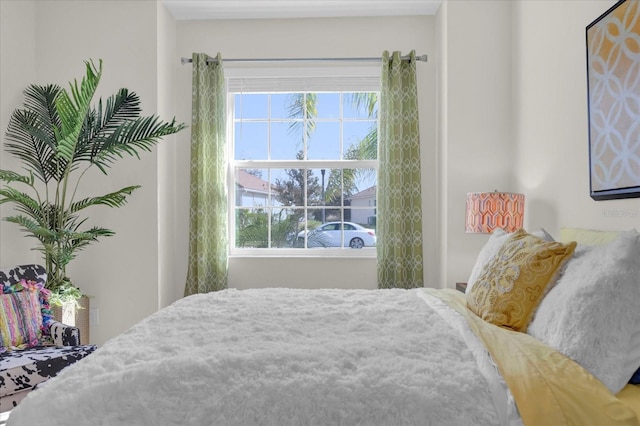 bedroom featuring multiple windows