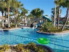 view of pool featuring a water slide