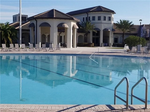 view of pool featuring a patio