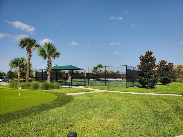 surrounding community featuring tennis court