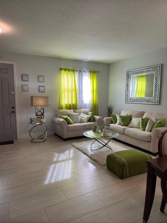 living room with a textured ceiling