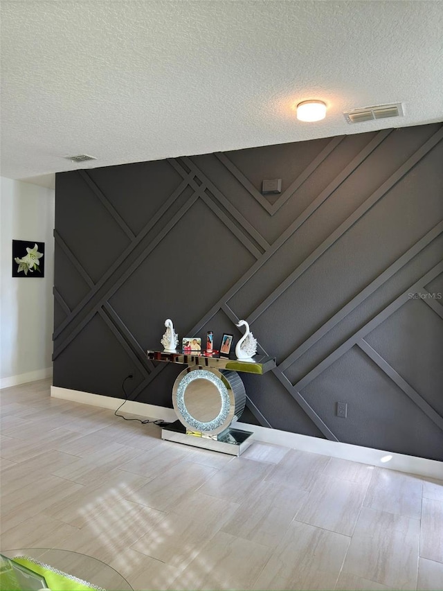 interior details featuring a textured ceiling