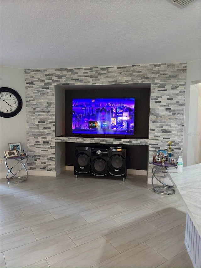 unfurnished living room featuring a textured ceiling