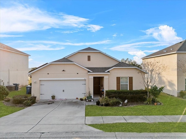 ranch-style house featuring a garage, driveway, roof with shingles, stucco siding, and a front yard