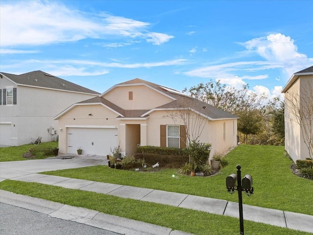 ranch-style house featuring a garage, driveway, a front yard, and stucco siding