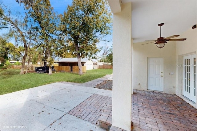 view of patio / terrace featuring ceiling fan and french doors