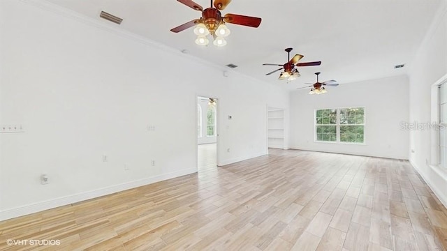 unfurnished living room with crown molding and light hardwood / wood-style flooring